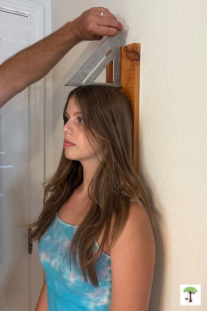 How to measure height accurately on a growth measurement chart.
