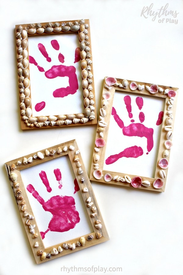 shell frame - picture frames decorated with shells with handprint art placed inside