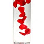 homemade Valentine's Day sensory bottle with slow falling acrylic hearts (Made and photographed by Nell Regan K. founder of Rhythms of Play)