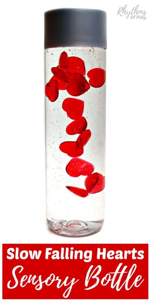 homemade Valentine's Day sensory bottle with slow falling acrylic hearts (Made and photographed by Nell Regan K. founder of Rhythms of Play)