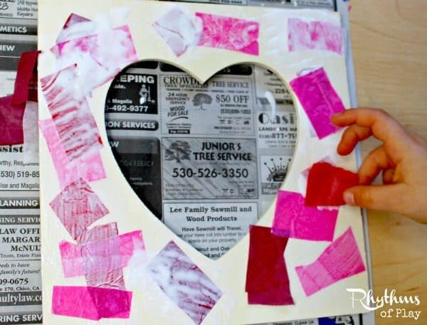 This upcycled tissue paper heart frame is an easy craft for both kids and adults. It makes a perfect gift for Valentine's Day, Mother's Day, Father's Day, Christmas, weddings, anniversaries, birthday's, or any other special occasion.