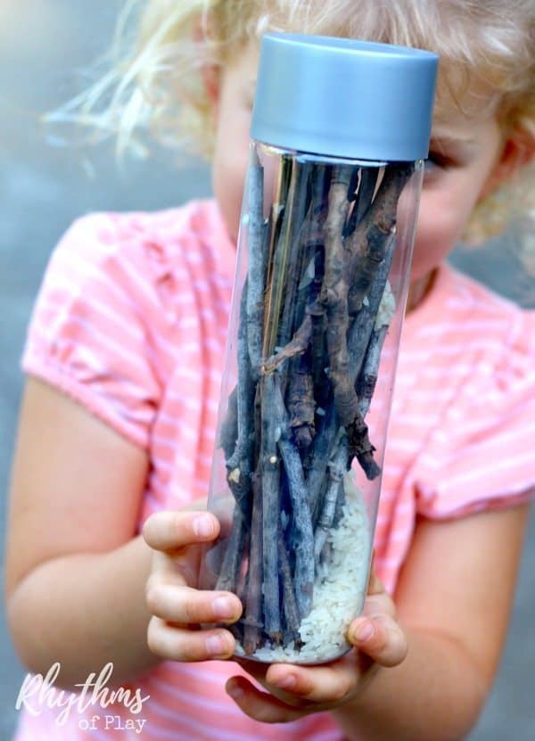 DIY rainstick musical sensory bottle made with sticks in a recycled bottle. 