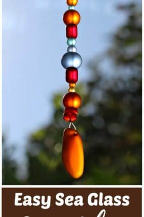 DIY sea glass suncatcher craft made with blue and red sea glass beads