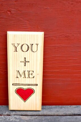 This DIY rustic woodburning keepsake gift idea is a fun and easy project for Valentine's Day, weddings, and anniversaries. It is the perfect gift for the five-year wedding anniversary which is traditionally made of wood. It is super simple to make even if you have never tried using a wood burning pen before. You can use the free printable template on any piece of wood. Click through for the easy to follow tutorial!