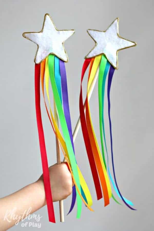 child holding DIY Rainbow Ribbon Fairy Wands