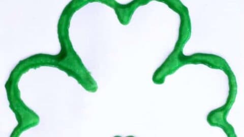 Making a Saint Patrick's Day salt paint shamrock is an easy art project and craft for kids that only takes minutes to set up. Toddlers, preschoolers, and elementary kids will enjoy the raised salt and watercolor painting technique used to create this St Patrick's Day decoration. Try it today!