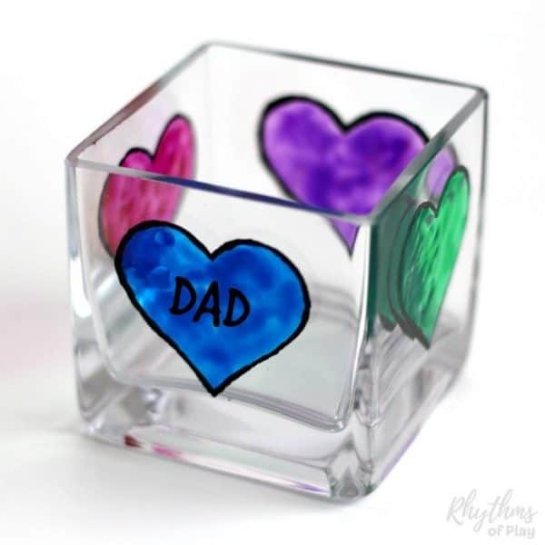 DIY Father's Day Gift Idea - Dads and grandpas love homemade personalized keepsake gifts for Father's Day! Creating gorgeous stained glass hearts on square votive candle holders and personalizing them for daddy or papa is fun and easy for both kids and adults. Anyone that can draw or trace can do this easy handmade craft project.