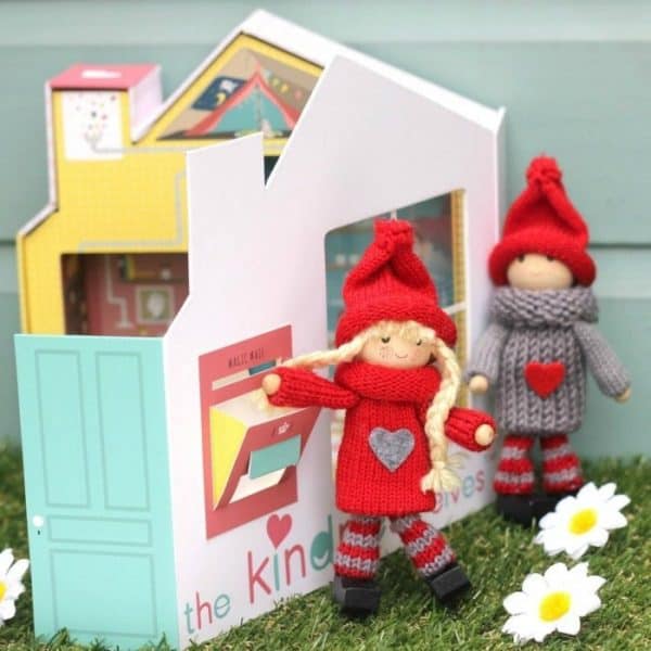 Red and grey Elves putting kindness suggestion in the mailbox