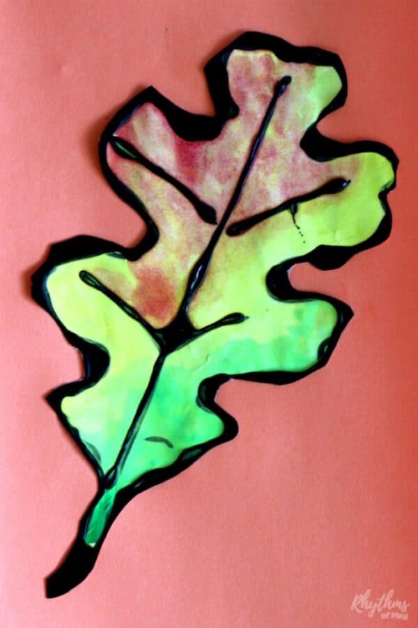 Oak fall leaves art project using watercolors and black resist medium.