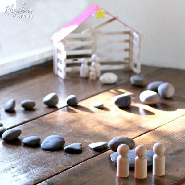simple stone advent calendar shown with popsicle stick nativity stable and 3 wise men