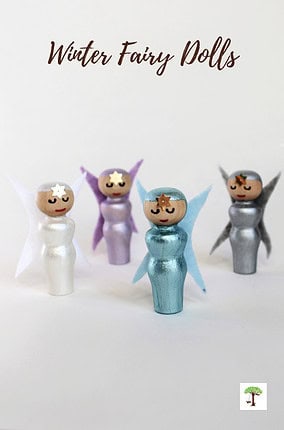 Fairy dolls made with wooden peg dolls, paint, and felt in frosty winter colors.