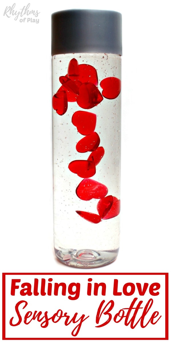 slow falling hearts diy sensory bottle for Valentine's Day or any day! (Made and photographed by Nell Regan K. founder of Rhythms of Play)