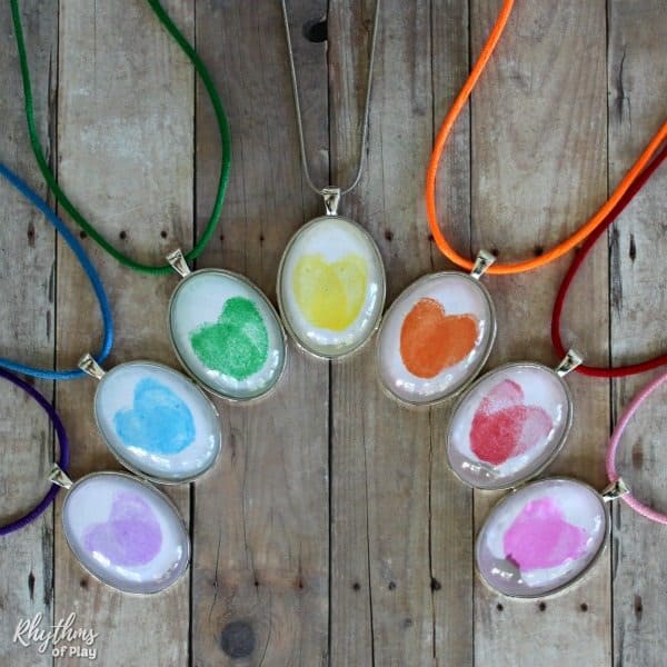 Rainbow thumbprint heart oval pendant necklaces (DIY thumbprint heart necklaces and photographs by Nell Regan K. and C. Kartychok co-founders of Rhythms of Play)