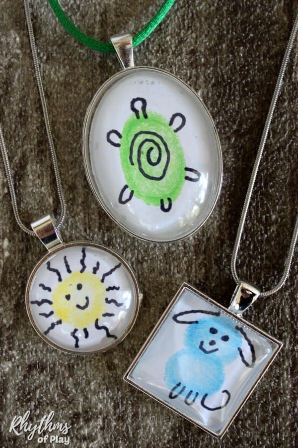 Turtle, sun and dog fingerprint art necklace pendants (crafts by Nell Regan K and Charlize Kartychok.)