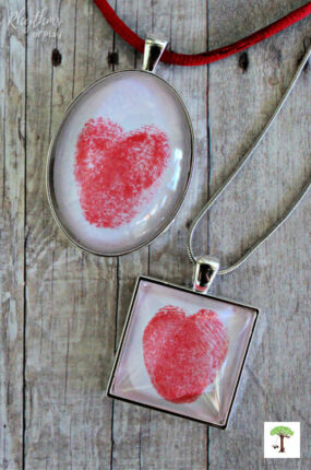 Square and oval thumbprint heart necklace pendants charms (DIY thumbprint heart necklaces and photographs by Nell Regan and Charlize Kartychok co-founders of Rhythms of Play)