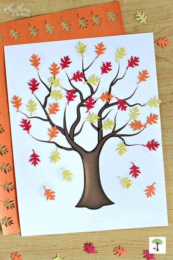 Fall tree craft - place construction paper leaves on a bare fall tree to make this fall art collage