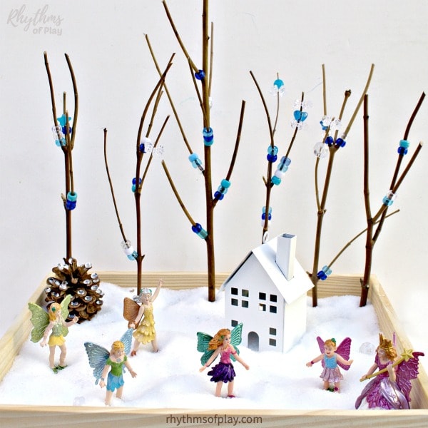 winter fairy garden with fairies and twig trees in epson salt snow 