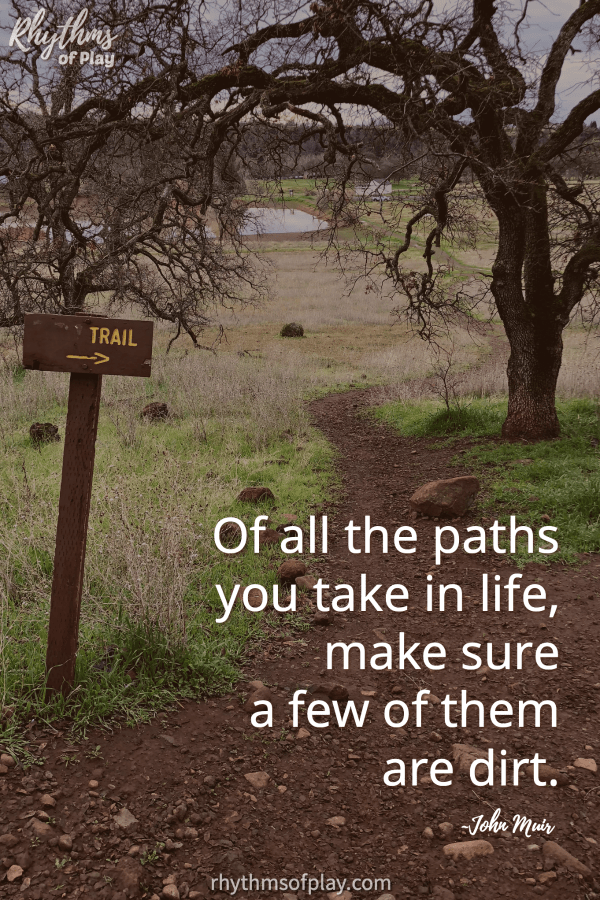 Hiking trail on Lughnasadh with quote " Of all the paths you take in life, make sure a few of them are dirt."