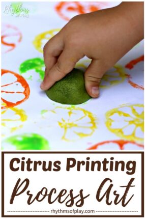 kid making citrus art prints with a lime and tempura paint on paper