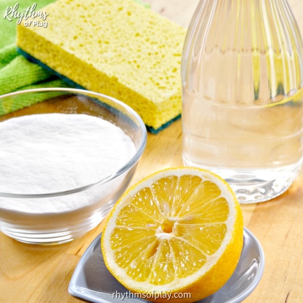 ingredients used to make DIY natural cleaning products; baking soda, vinegar, and lemon.