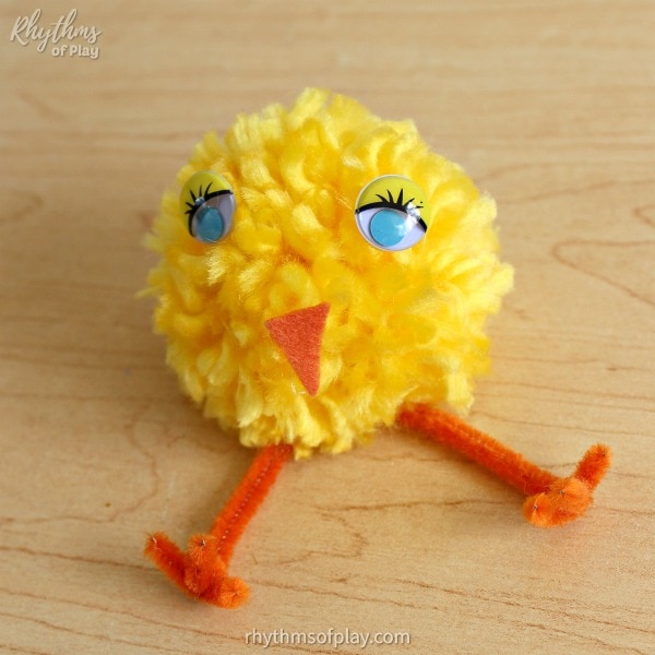 fluffy yellow pom-pom chick craft with pretty blue eyes