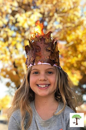 Girl wearing a gorgeous fall leaf crown with real autumn leaves