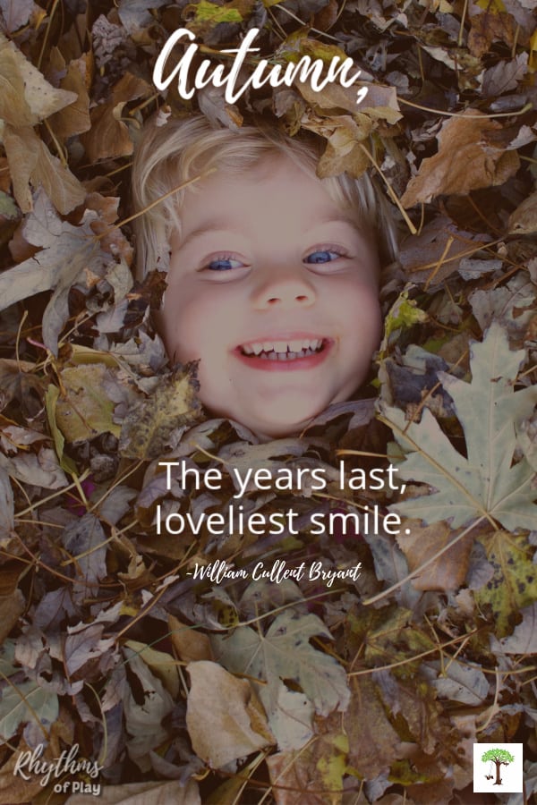 kid covered in pile of leaves smiling with quote "Autumn, the years last loveliest smile." (photo of Charlize Kartychok by Nell Regan K.)