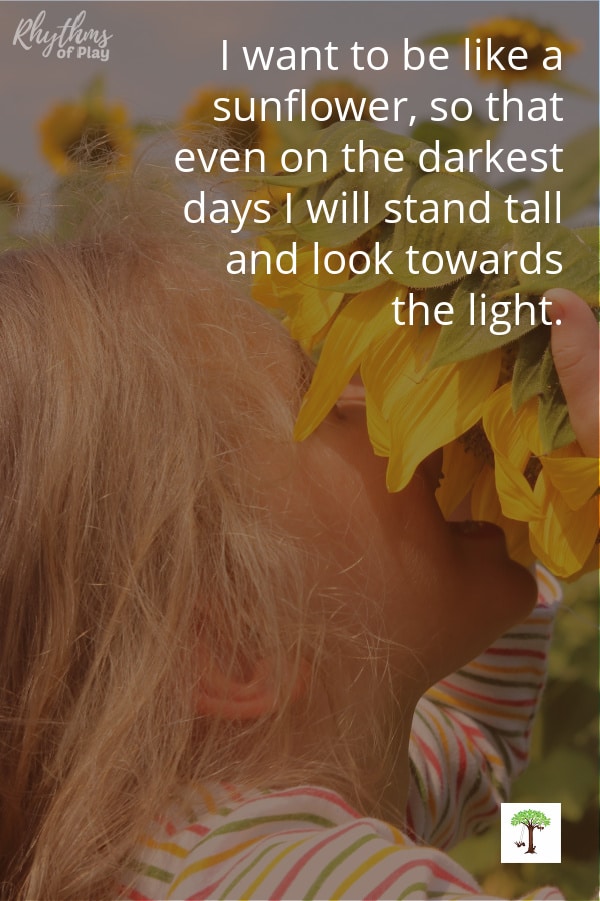 girl with sunflower in her face with quote, "I want to be like a sunflower, so that even on the darkest days I will stand tall and look towards the light."