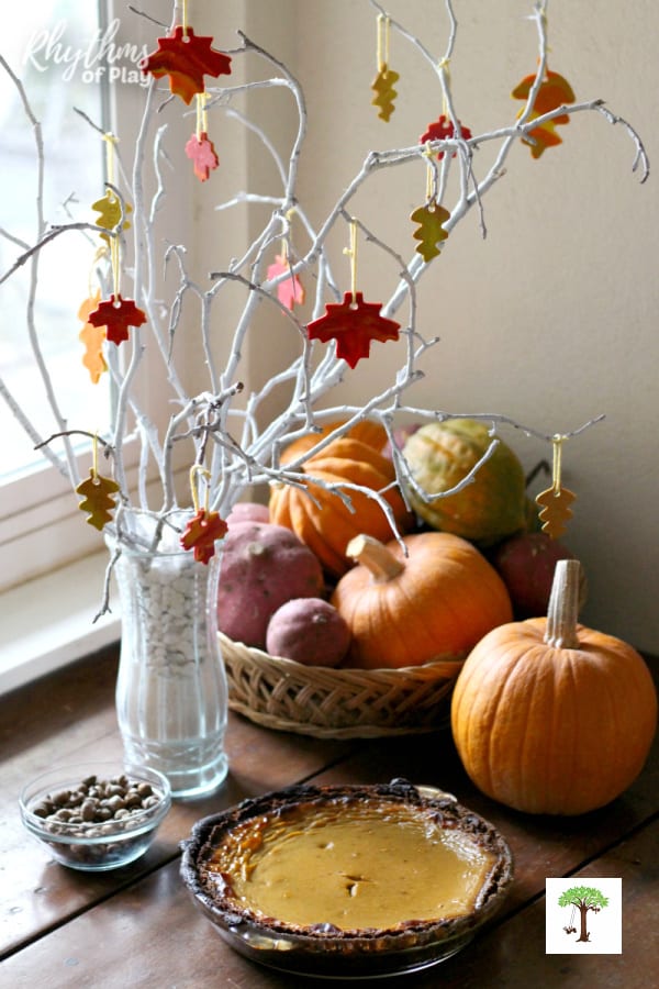 DIY Thanksgiving thankful tree decorated with clay gratitude leaf crafts.