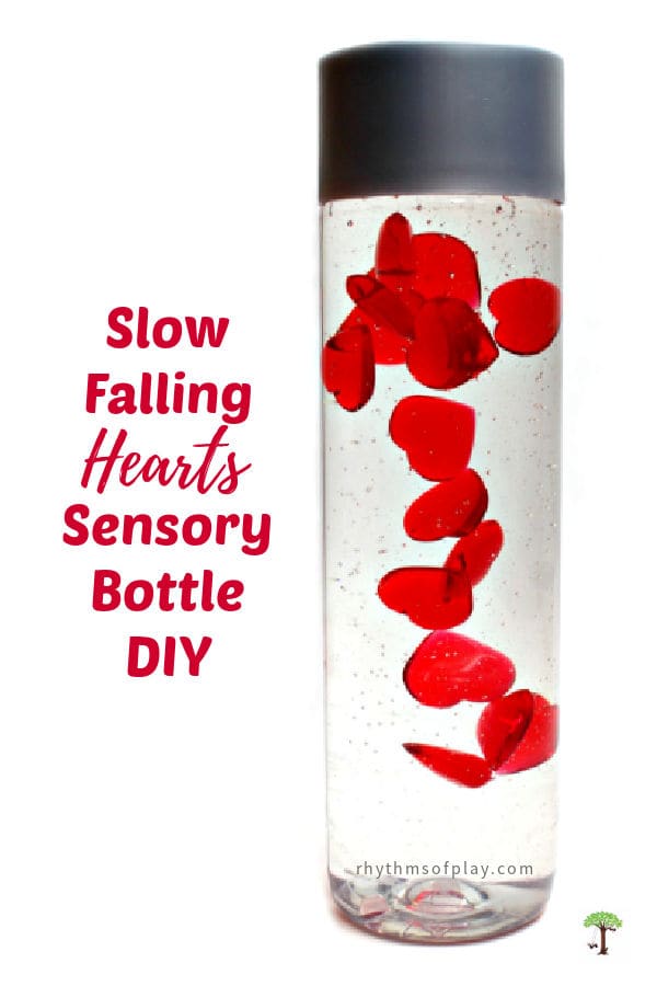 Valentine's Day sensory bottle with slow falling hearts made and photographed by Nell Regan Kartychok founder of Rhythms of Play.