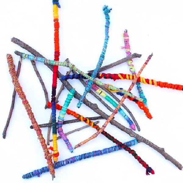 Stick nature craft: Sticks wrapped with colorful yarn or embroidery thread.